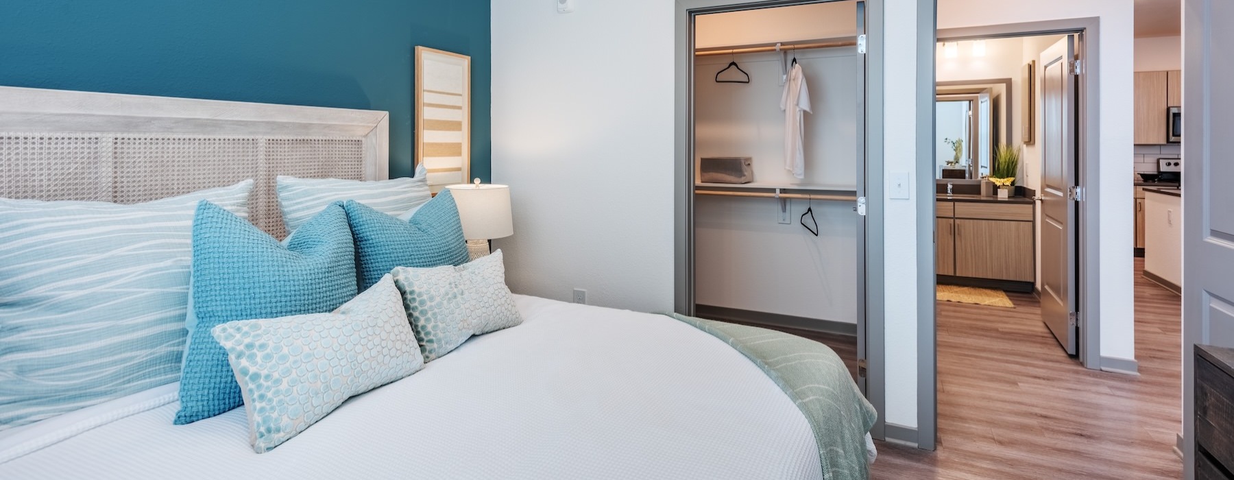 a bedroom with a bed and a closet