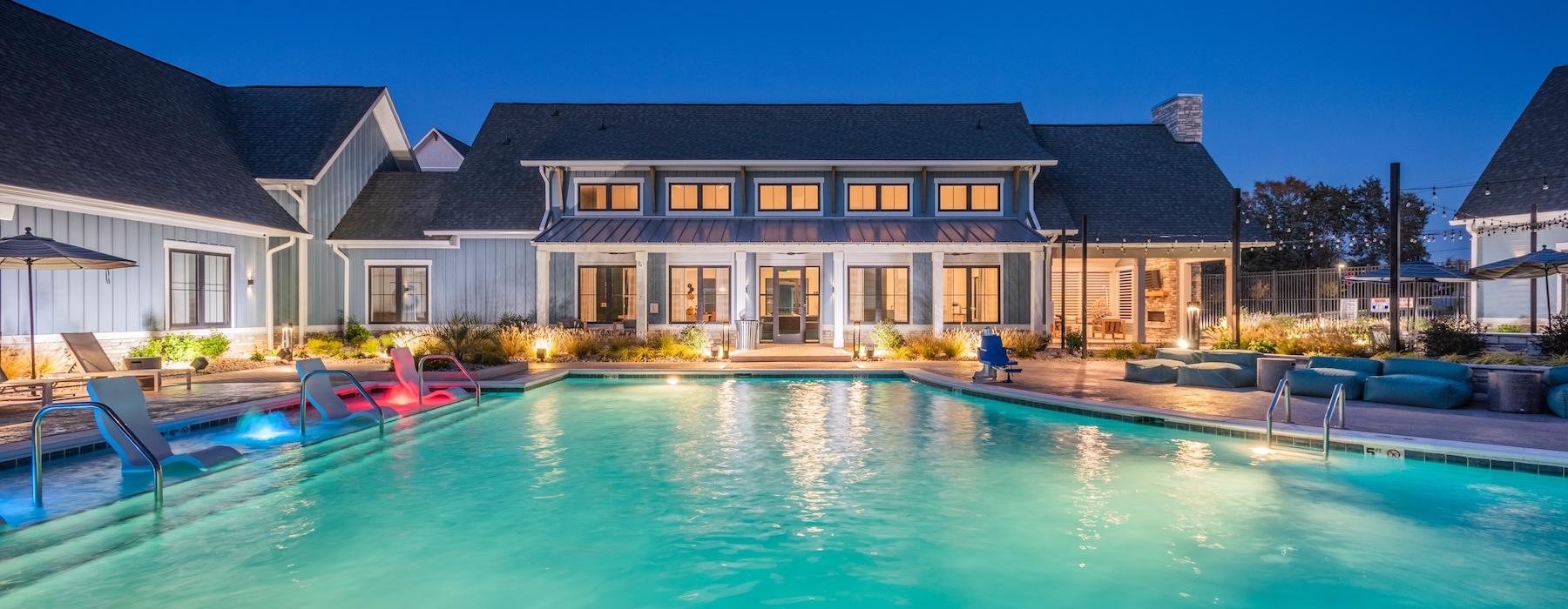 a swimming pool in front of a building